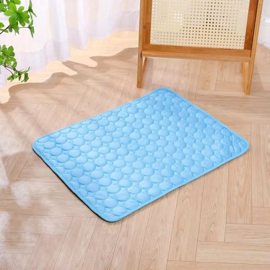 Pawcoola cooling mat in blue on a timber floor